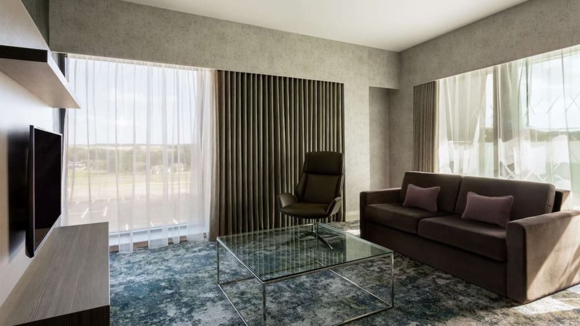 Presidential suite with lounge area at Hilton Aberdeen TECA.