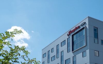 Hotel exterior by day at Hampton By Hilton London Gatwick Airport.