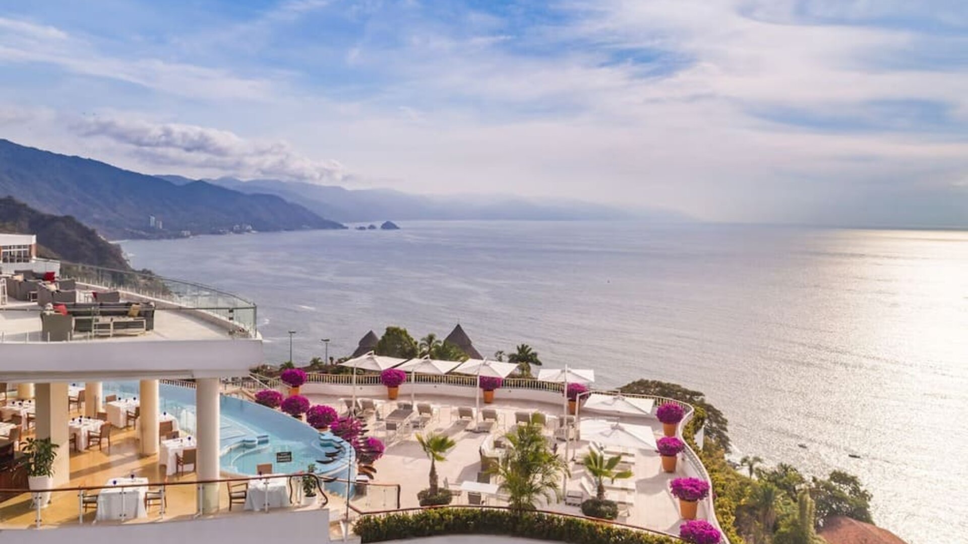 Hotel exterior with sea view at Grand Miramar All Luxury Suites & Residences.