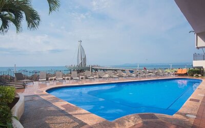 Luxurious outdoor pool at Hotel Delfin PV Beach Resort.