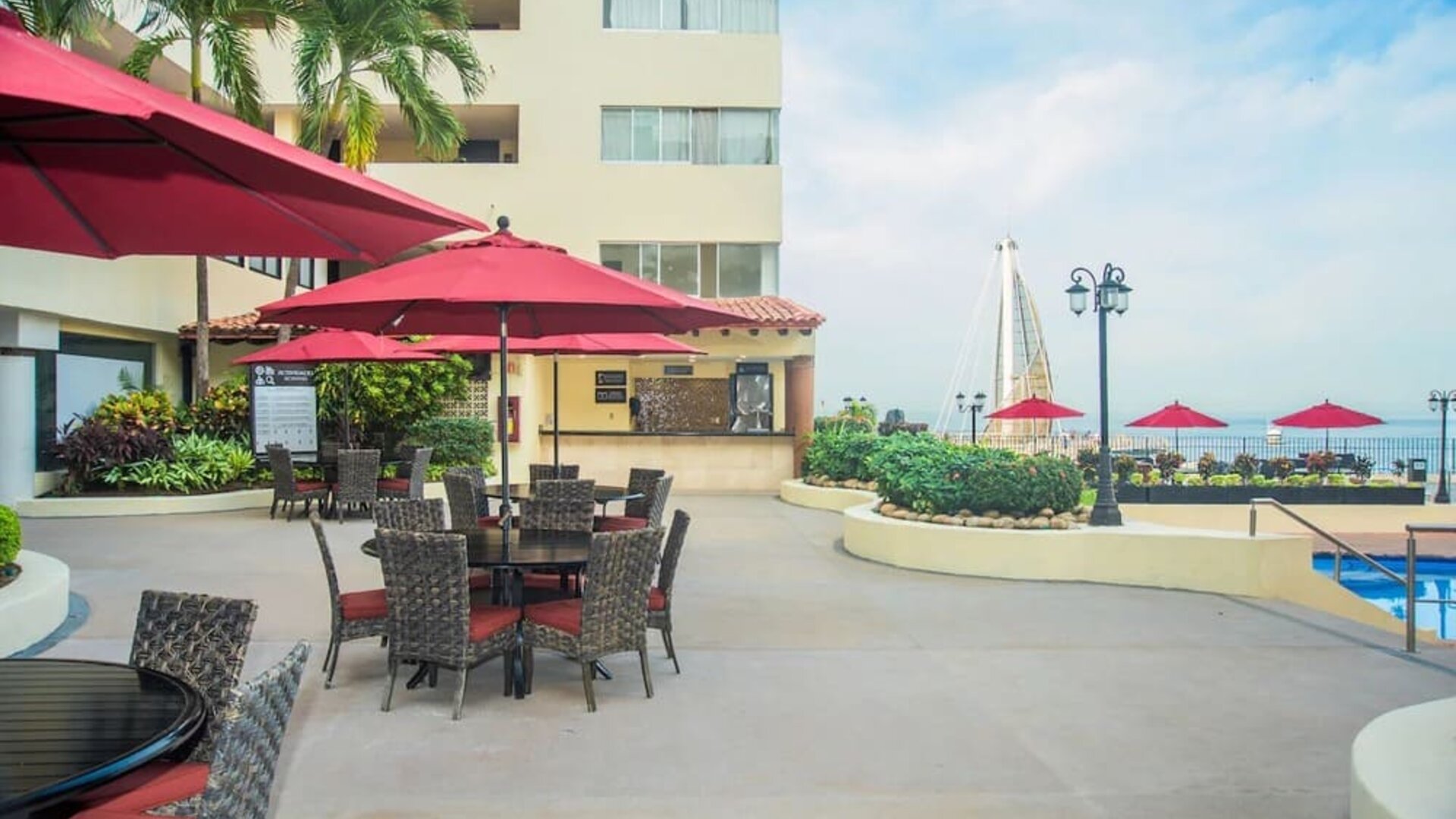 Outdoor seating and coworking space at Hotel Delfin PV Beach Resort.