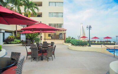 Outdoor seating and coworking space at Hotel Delfin PV Beach Resort.