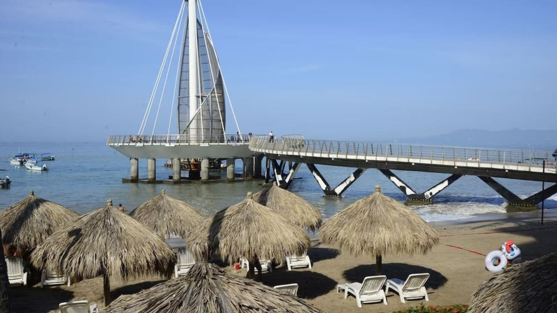 Beach access and marina at Hotel Delfin PV Beach Resort.