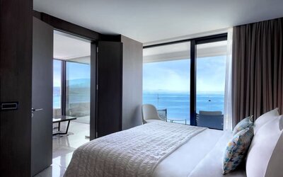 Romantic king room with natural light at Le Méridien Bodrum Beach Resort.