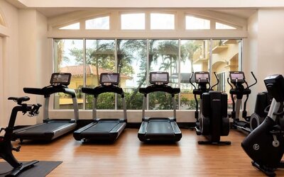 Fitness center available at Embassy Suites By Hilton Deerfield Beach Resort & Spa.