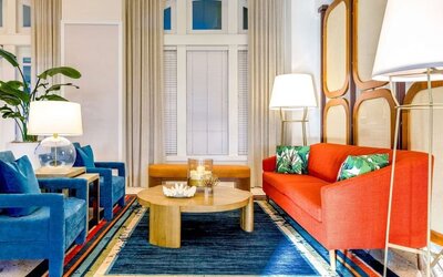 Coworking space and lobby seating at Embassy Suites By Hilton Deerfield Beach Resort & Spa.