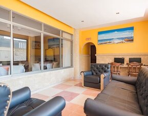 Lobby and coworking lounge at Hotel Rivera Del Mar.