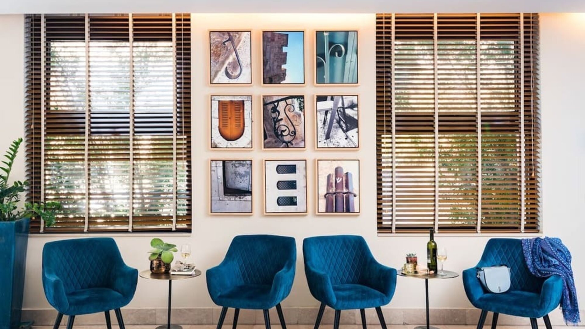 Coworking space and blue chairs at Prima Royale Hotel.