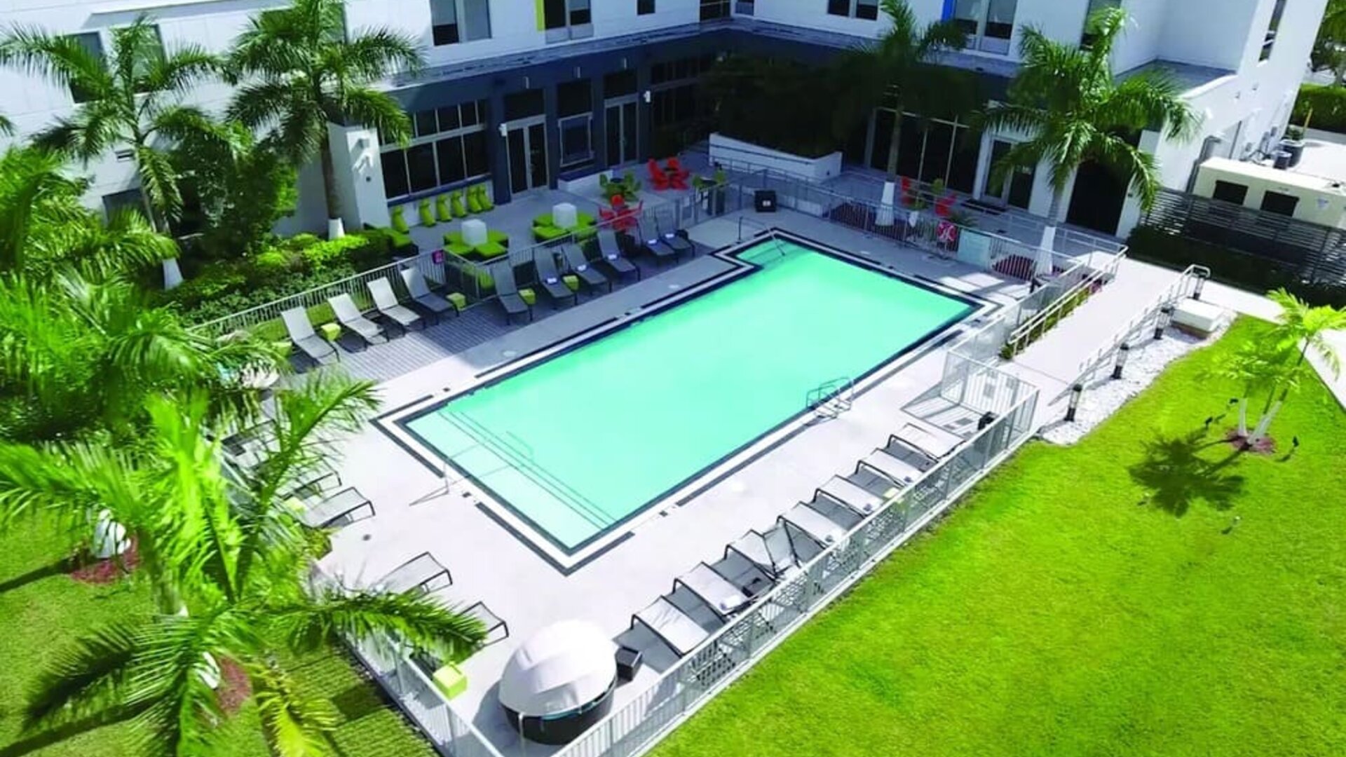 Outdoor pool area at Aloft Miami Doral.
