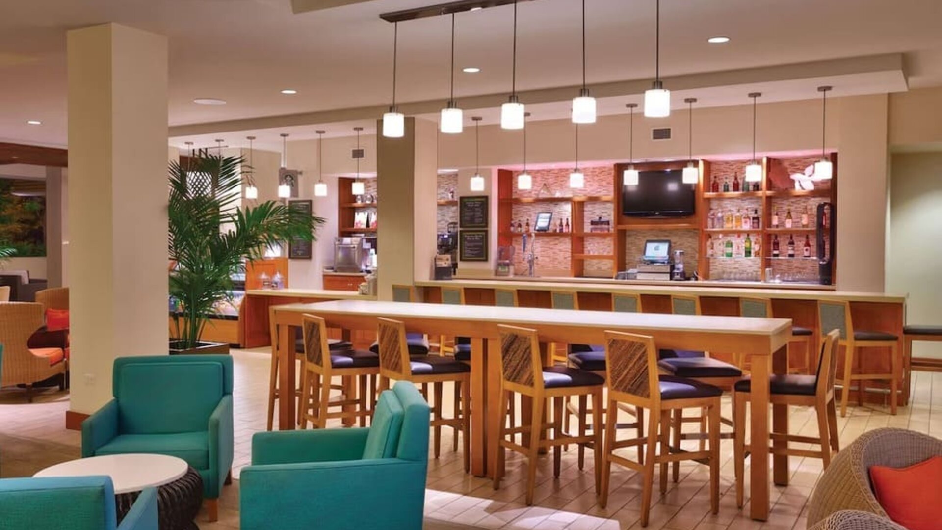 Hotel bar and coworking area at Hyatt Place Waikiki Beach.