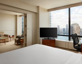 Comfortable day use room with TV and lounge at M Social New York Downtown.