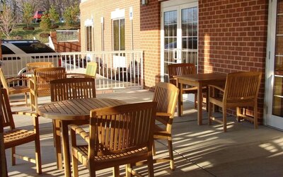 Outdoor seating and terrace at Country Inn & Suites By Radisson, BWI Airport.