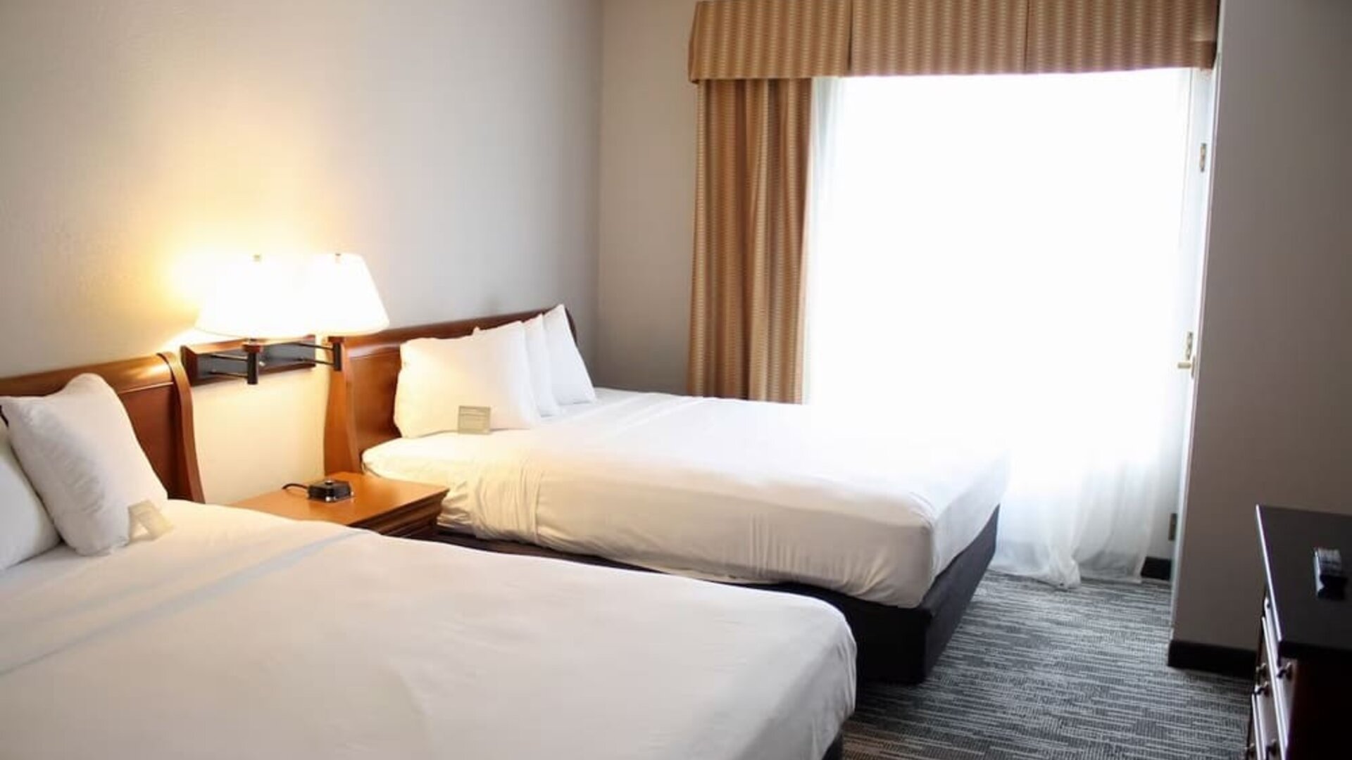 Spacious day room with two queen beds at Country Inn & Suites By Radisson, BWI Airport.