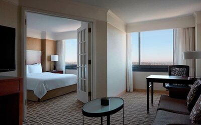 Spacious king suite with lounge area at Washington Dulles Marriott Suites.