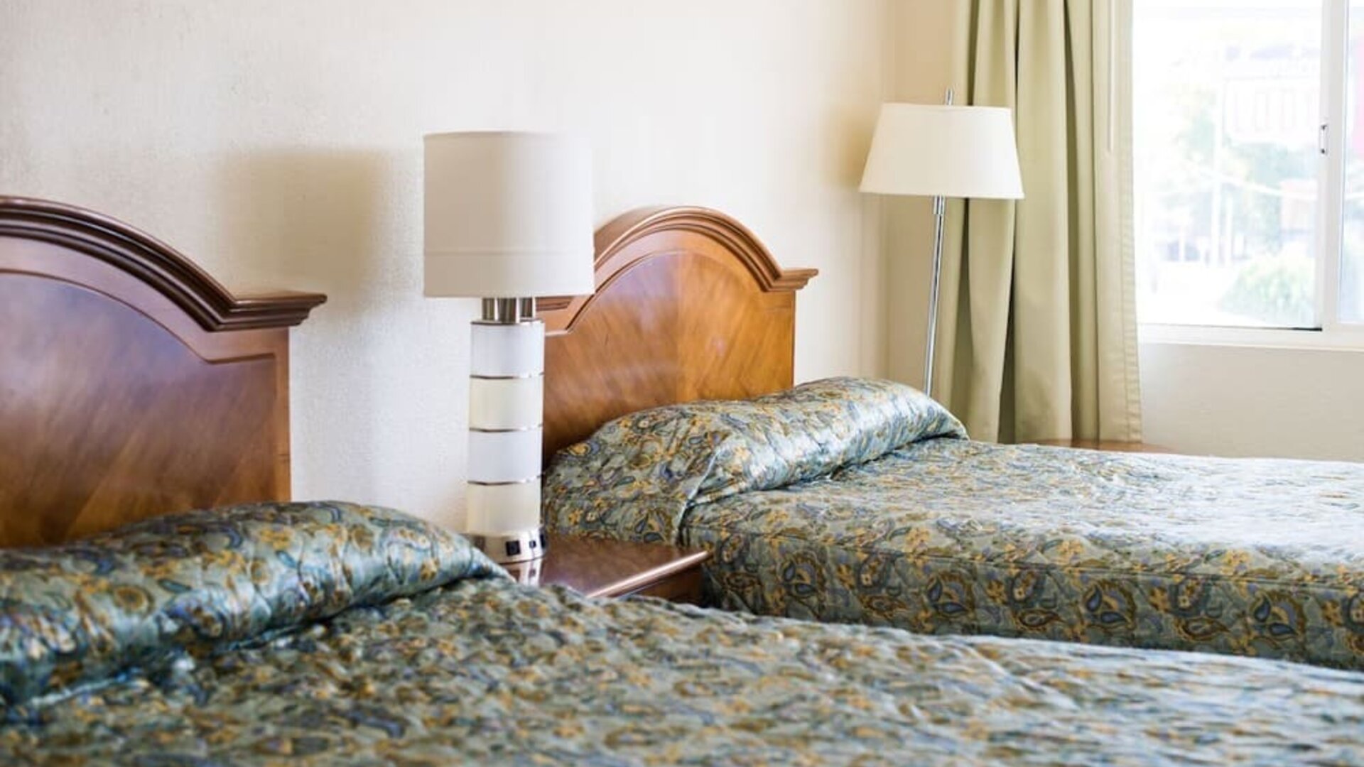 Day room with two queen beds at Stardust Motel Redding.