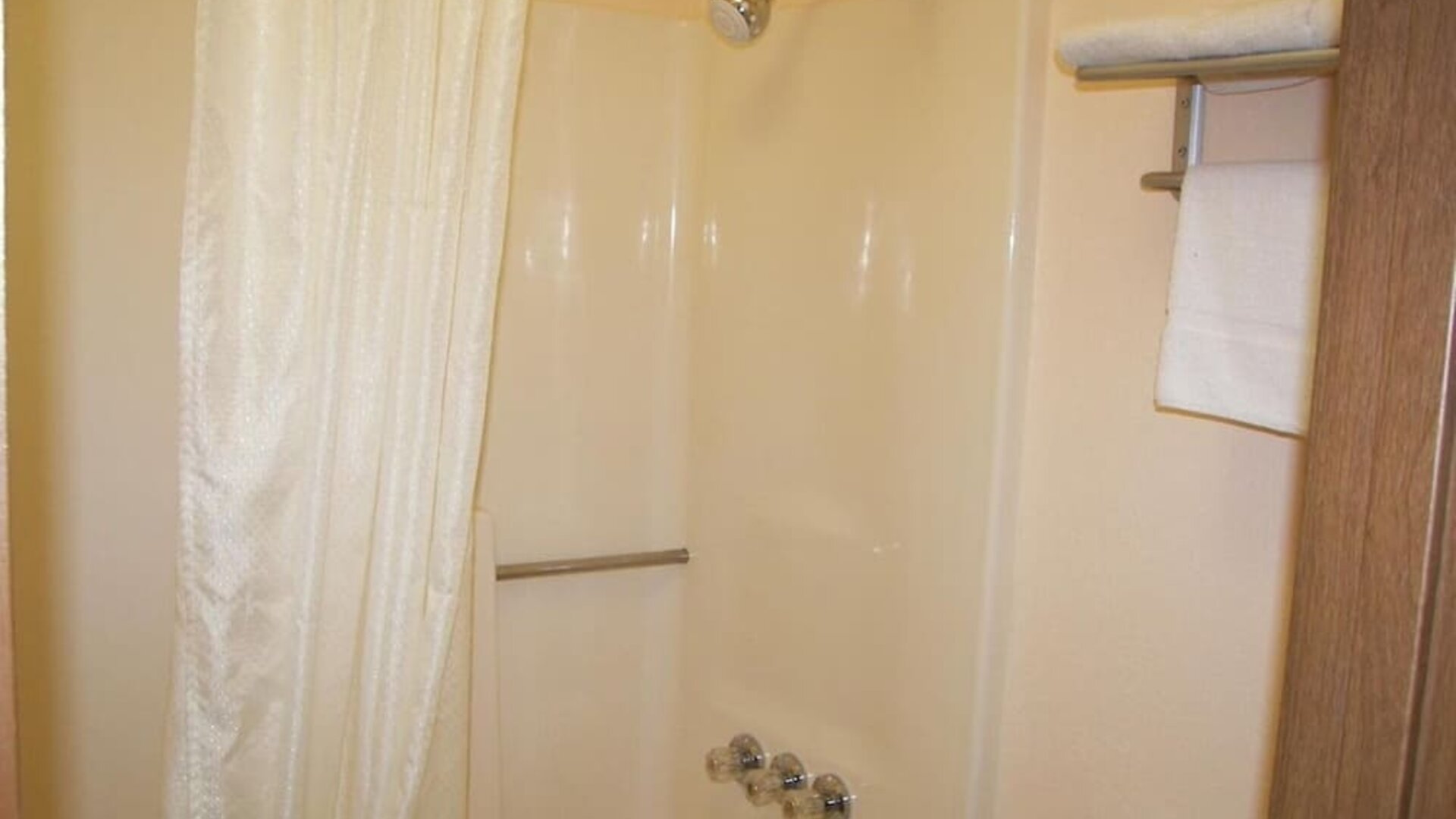 Guest bathroom with shower at Stardust Motel Redding.