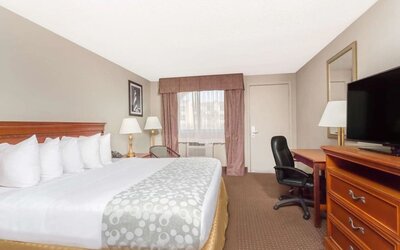 Day use room with TV and work desk at Days Inn By Wyndham St Augustine/Historic Downtown.