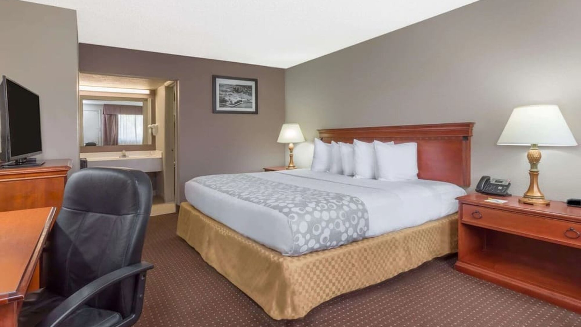 Day room with TV at Days Inn By Wyndham St Augustine/Historic Downtown.