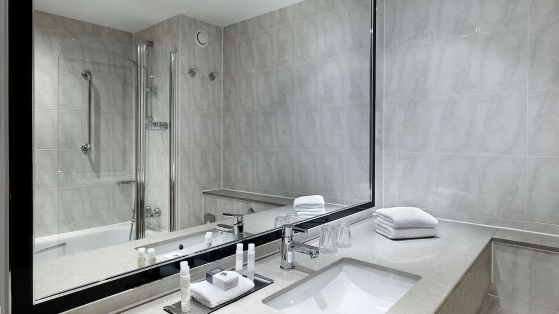 Guest bathroom with shower at DoubleTree By Hilton Woking.