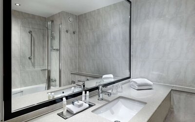 Guest bathroom with shower at DoubleTree By Hilton Woking.