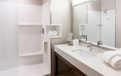 Guest bathroom with shower at Courtyard By Marriott Houston North/ Shenandoah.  