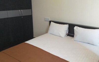 Simple king room at The Nisarga Grand.