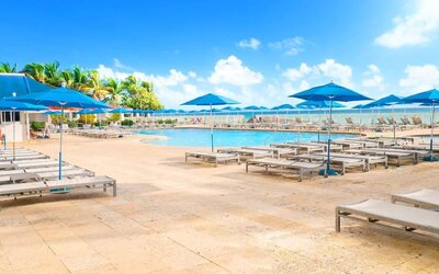 Relaxing pool area at Ramada Plaza Marco Polo Beach Resort.