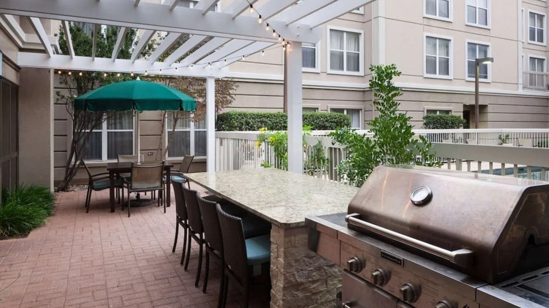 Outdoor barbeque area at Homewood Suites By Hilton Austin NW Near The Domain.