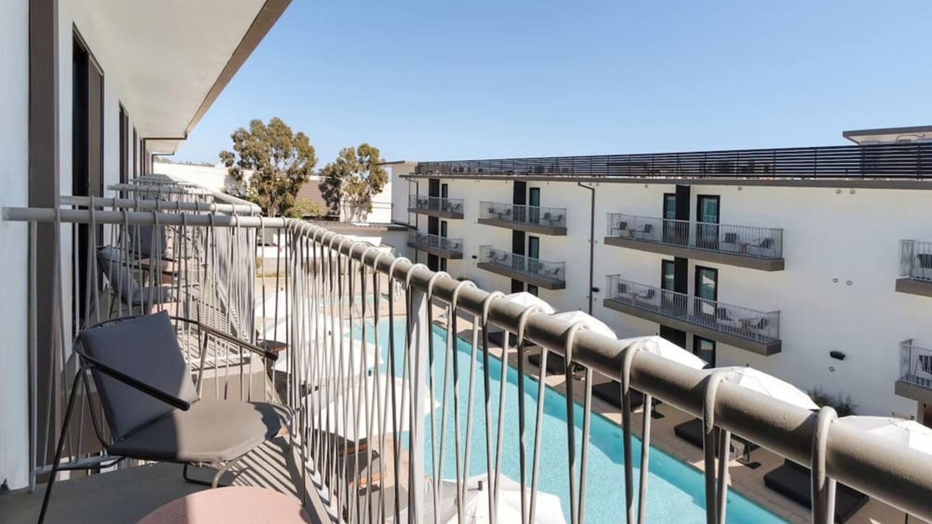 Day room with balcony at Lum Hotel Inglewood.