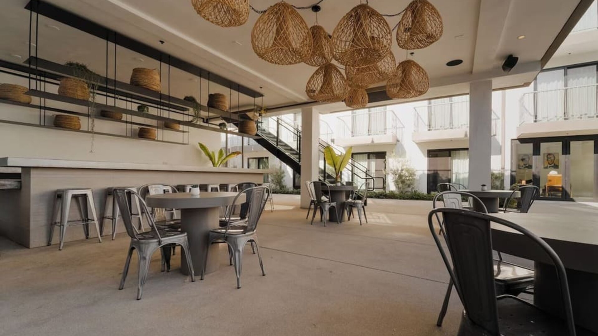 Lounge, bar, and dining area at Lum Hotel Inglewood.