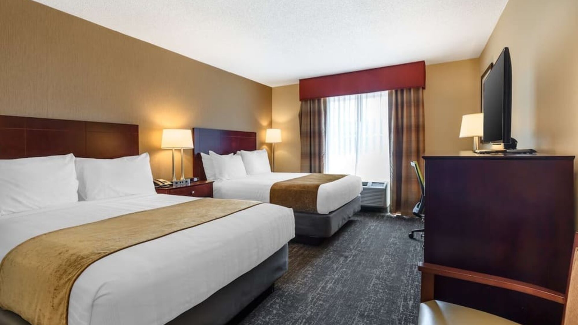Spacious double queen room with two comfortable beds, flat-screen TV, and contemporary décor at Best Western Braintree.
