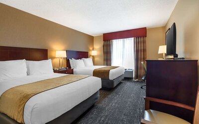 Spacious double queen room with two comfortable beds, flat-screen TV, and contemporary décor at Best Western Braintree.