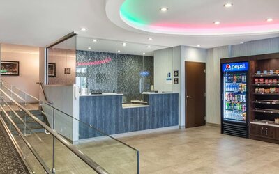 Welcoming lobby lounge with comfortable seating, snack station, and contemporary design at Best Western Braintree.