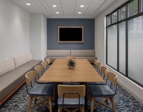 Flexible meeting room equipped for business meetings, presentations, and small group gatherings at Holiday Inn Express & Suites Boston-Cambridge.