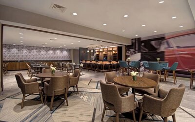 Stylish dining area with comfortable seating, modern décor, and ample space for breakfast, lunch, or evening dining at Four Points by Sheraton Boston-Newton.