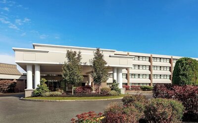 Exterior view showcasing the hotel’s welcoming entrance, landscaped grounds, and convenient access for guests arriving at DoubleTree by Hilton Westborough.