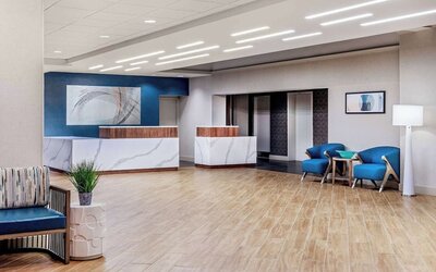 Contemporary hotel lobby with elegant reception desks, modern seating, and a welcoming arrival experience at DoubleTree by Hilton Westborough.