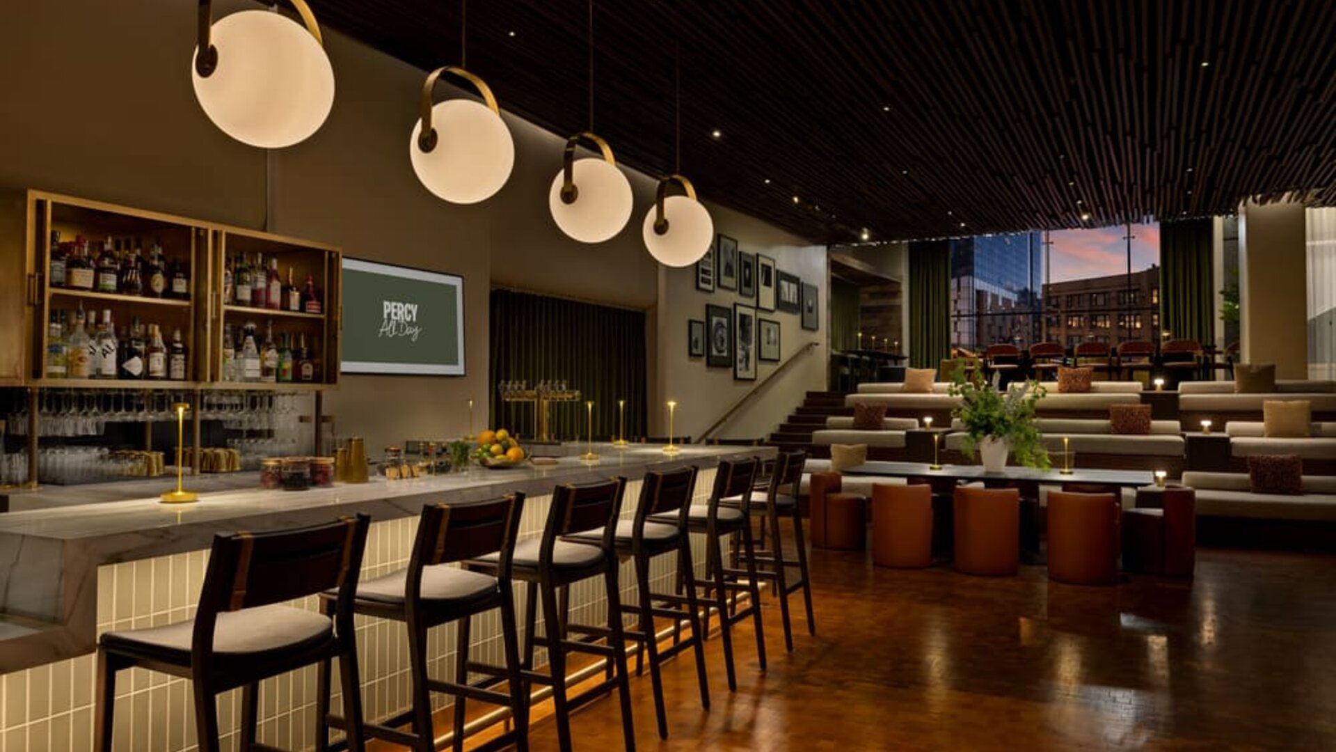 Stylish bar area offering handcrafted cocktails, modern seating, and a vibrant social atmosphere in the heart of Row NYC.