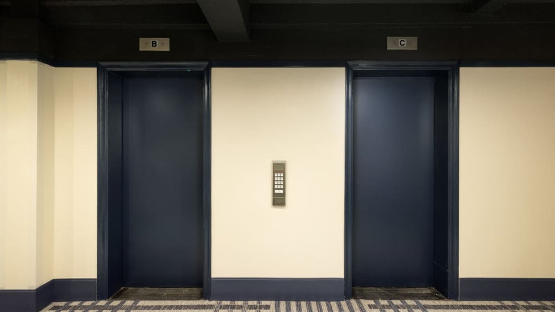 Elevator lobby featuring convenient guest access, modern finishes, and efficient transportation throughout Row NYC.
