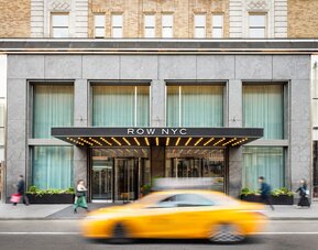 Main entrance of Row NYC featuring a contemporary façade, elegant lighting, and a welcoming arrival experience in the heart of New York City.