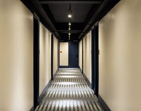 Guest corridor featuring modern lighting, contemporary décor, and convenient access to accommodations throughout Row NYC.