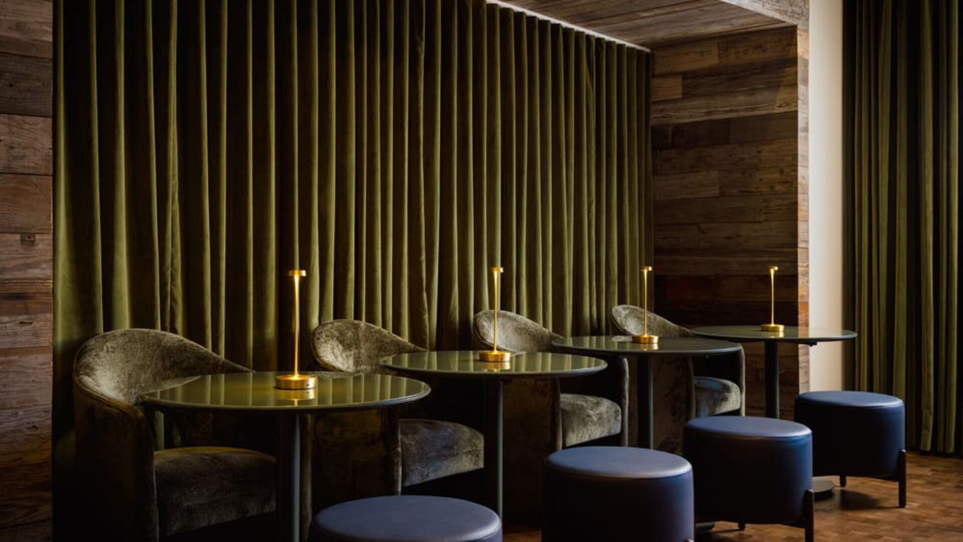 Intimate lounge seating area featuring plush furnishings, ambient lighting, and a sophisticated setting for relaxation or casual meetings at Row NYC.