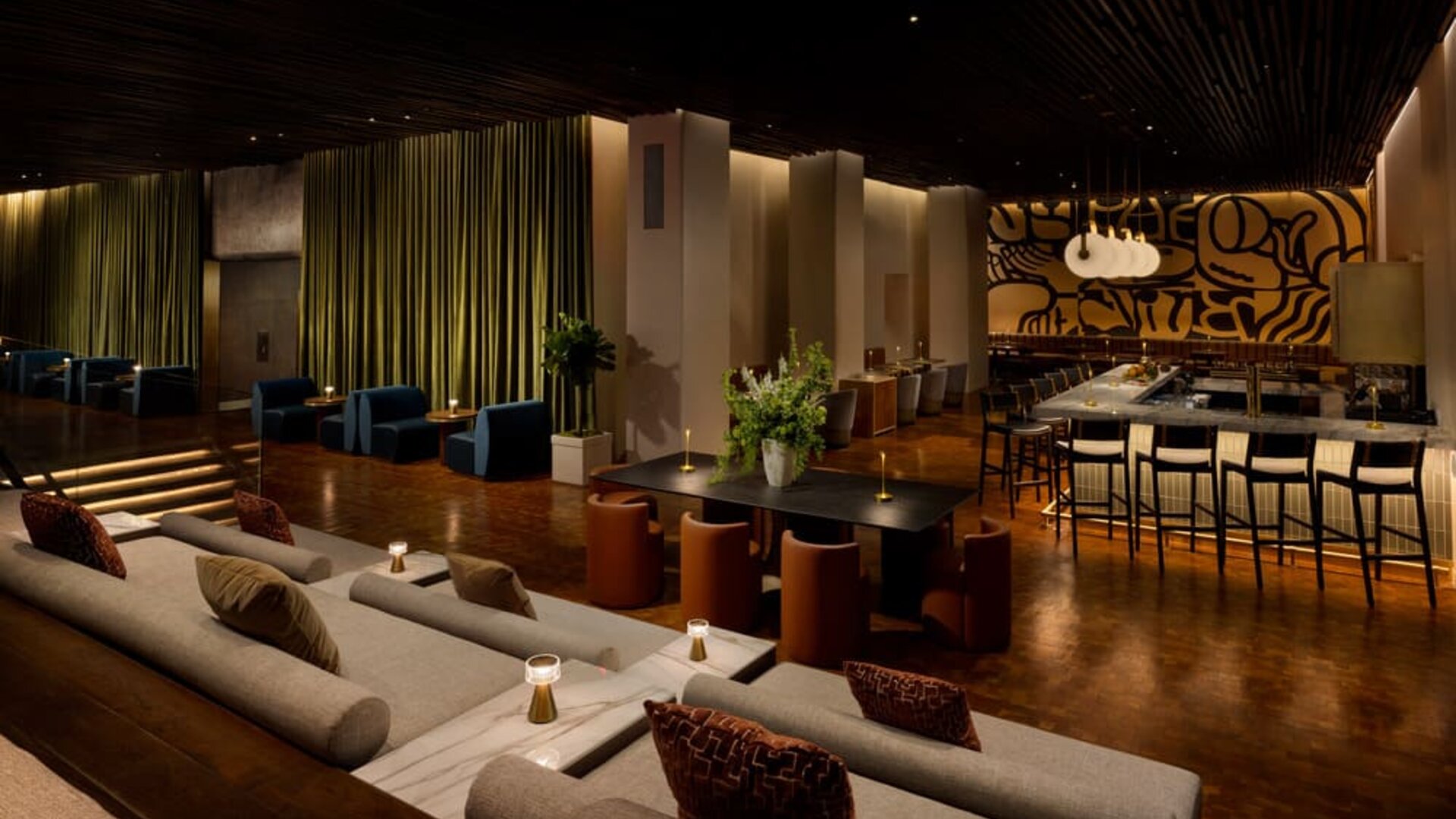 Expansive social lounge featuring contemporary seating, a stylish bar, and versatile gathering spaces designed for connection and comfort at Row NYC.