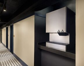 Convenient guest hydration station providing complimentary ice and water access along the guest room corridor at Row NYC.