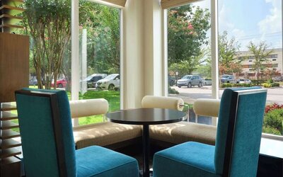 Lobby and coworking lounge at Hilton Garden Inn IAH Houston.