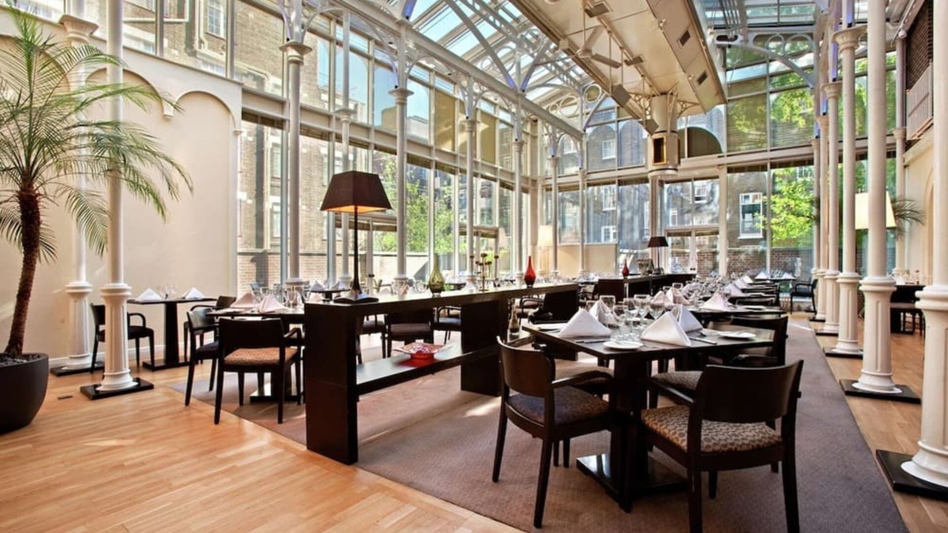 Dining area with natural light at Hilton London Euston.