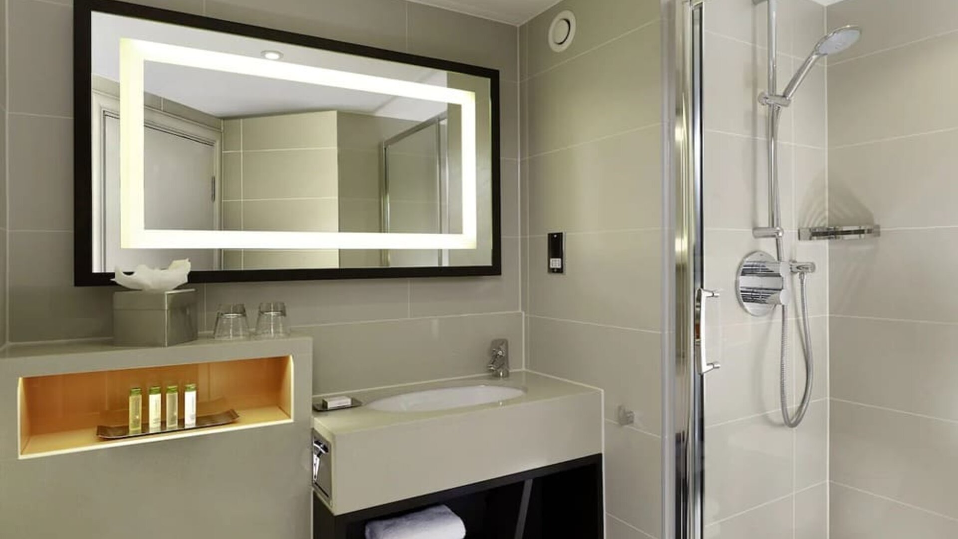 Guest bathroom with shower at DoubleTree By Hilton London - Ealing.