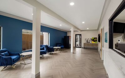 Lobby and coworking space at Signature Inn Houston Galleria.