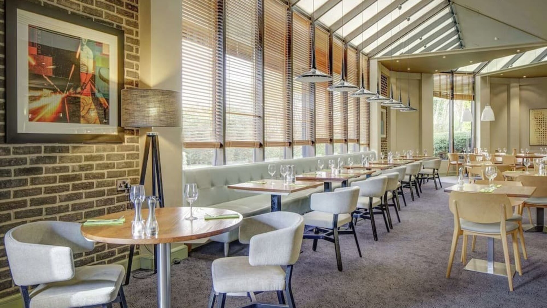 Spacious dining room with natural light at DoubleTree By Hilton Manchester Airport.