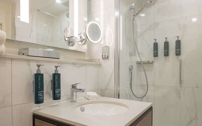 Guest bathroom with shower at DoubleTree By Hilton Manchester Airport.